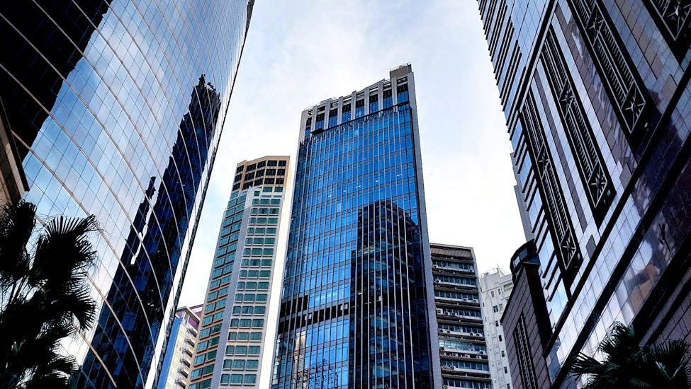 low angle shot of high rise buildings in hong kong