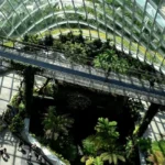 glass buildings with planets and greenery